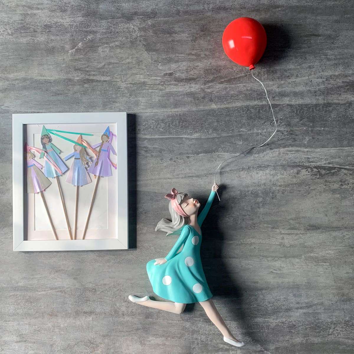 Cecille with a Balloon Wall Sculpture